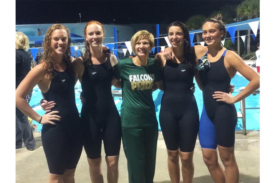 From left, seniors Lauri Schleicher, Kristi Schleicher, Coach Lee, Kristen Brockett, and Ellie Berdusco bask in their time at states. 