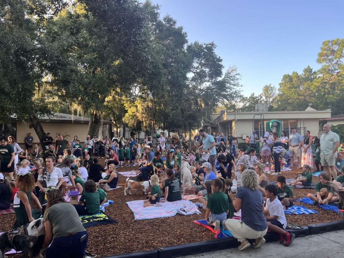 Family and friends gather for blessing of the animals.