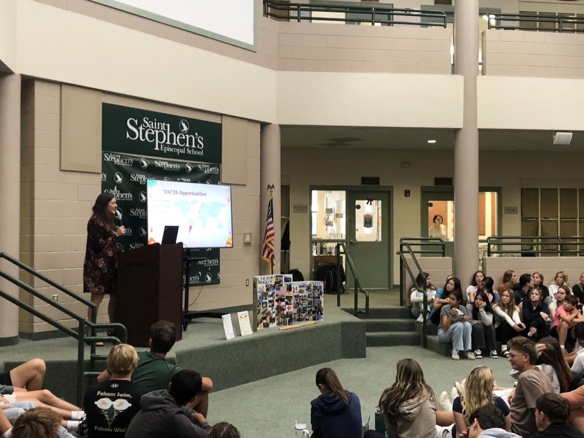 Global Education Coordinator Mrs. Jennifer Hambrick announces this year's Sister School Exchange Programs at an Upper School assembly. 