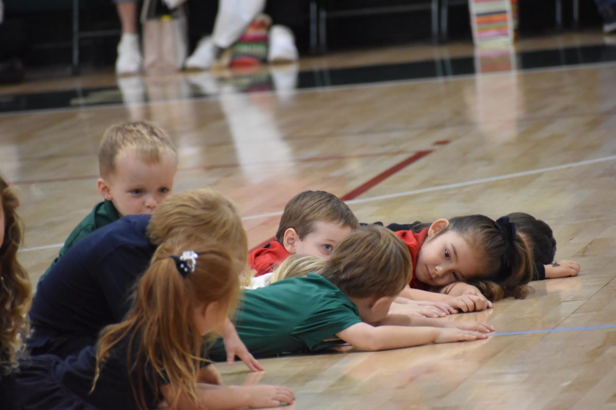 Lower Schoolers perform part of the nursery rhyme Humpty Dumpty where he had a "big fall."