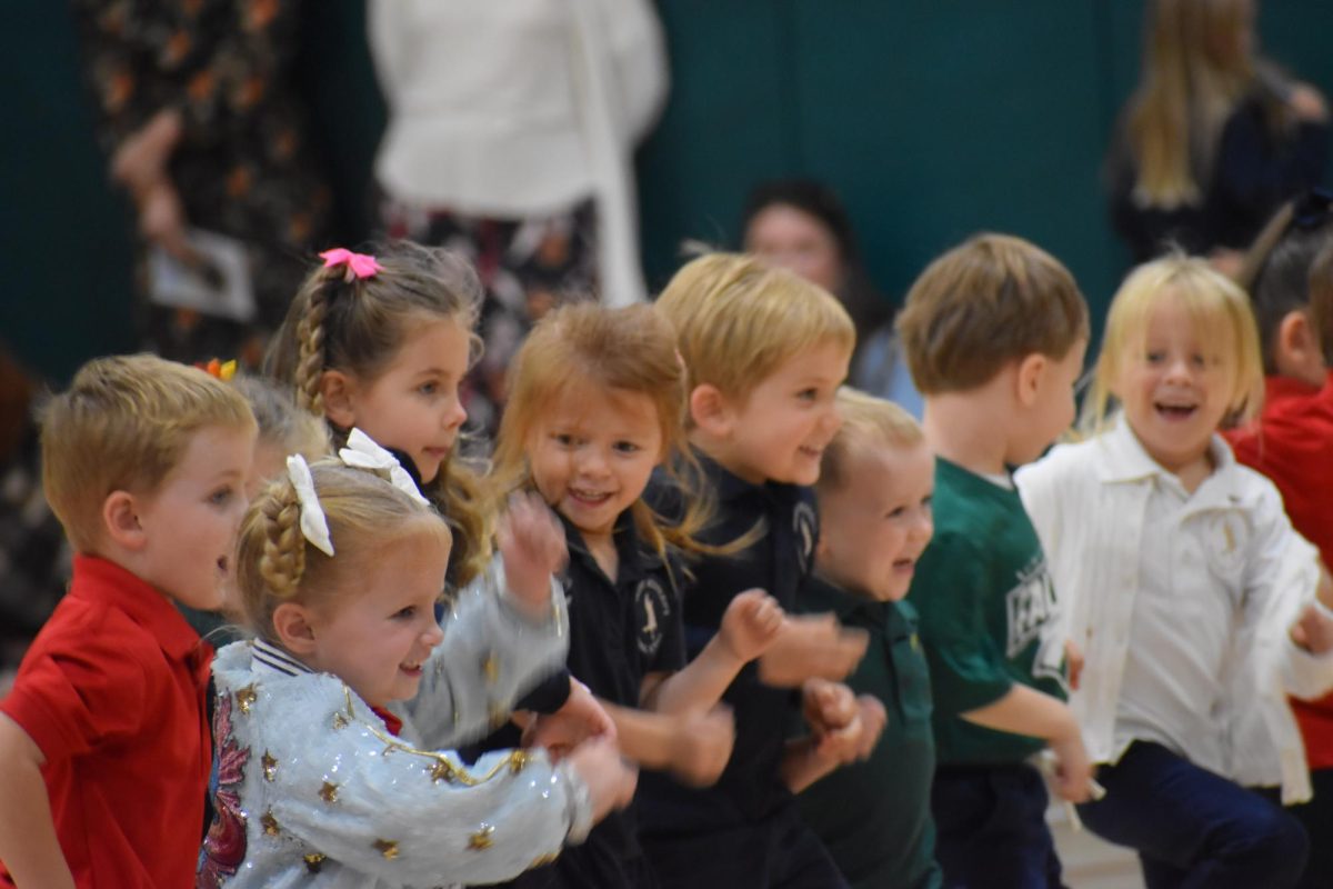 Fledgling Falcons have a blast when acting out the nursery rhyme Hickory Dickory Dock.