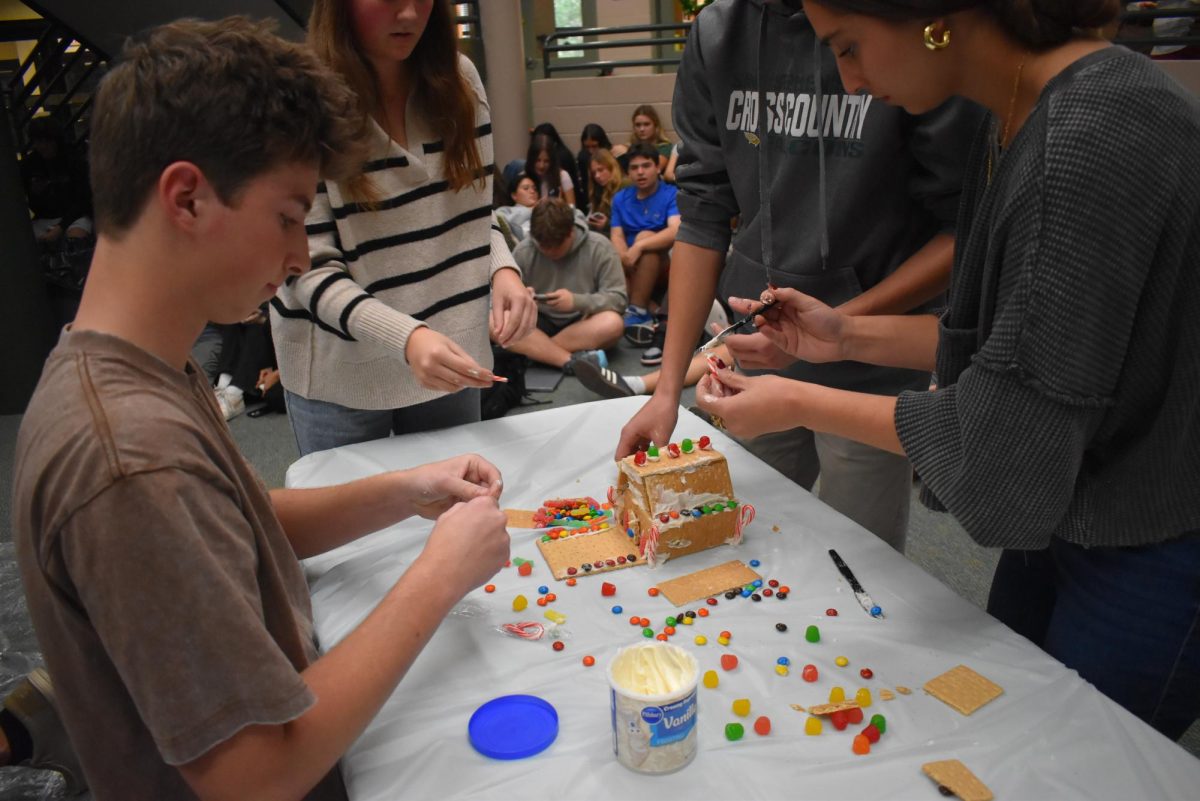 The juniors finish a detailed house that earned second place. 