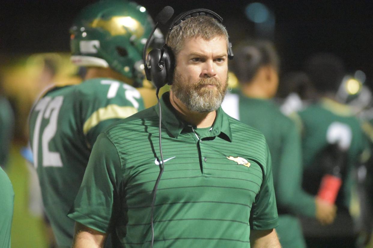 Coach Valcarcel in the action at a SSES football game.