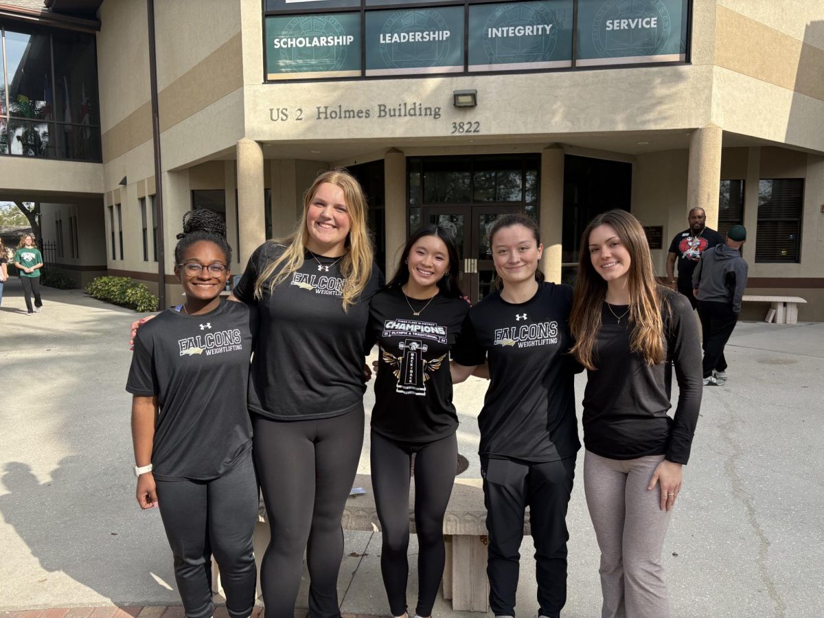 The five state championship qualifiers, Priscilla Webley, Annesley Flint, Makaila Hertzler, Emily Dowd, and Brooke Cosentino take a group photo after the gauntlet.