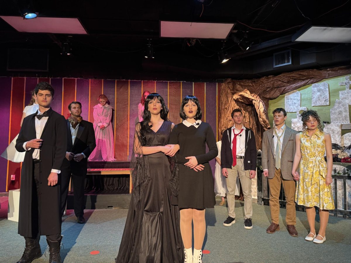 The cast of The Addams Family rehearses the last scene of the show.  The production goes live Thursday March 13.  Photo by Mrs. Jeannine Elisha. 